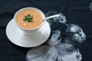 cheese soup with apple cider in a bowl