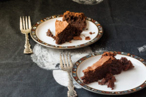 two slices of chocolate, ginger and hazelnut torte