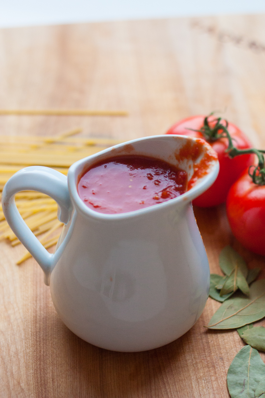 pitcher of tomato sauce and tomatoes