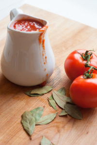 pitcher of tomato sauce and tomatoes