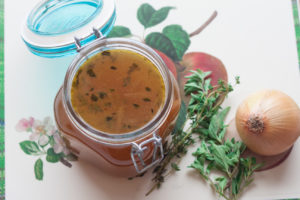 vegetable stock with onion and herbs