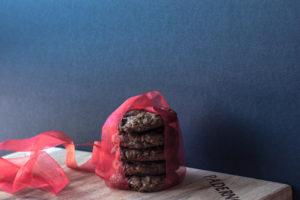 mocha chocolate chip oat cookie with red ribbon