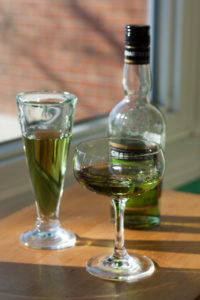 two glasses of Chartreuse and one bottle
