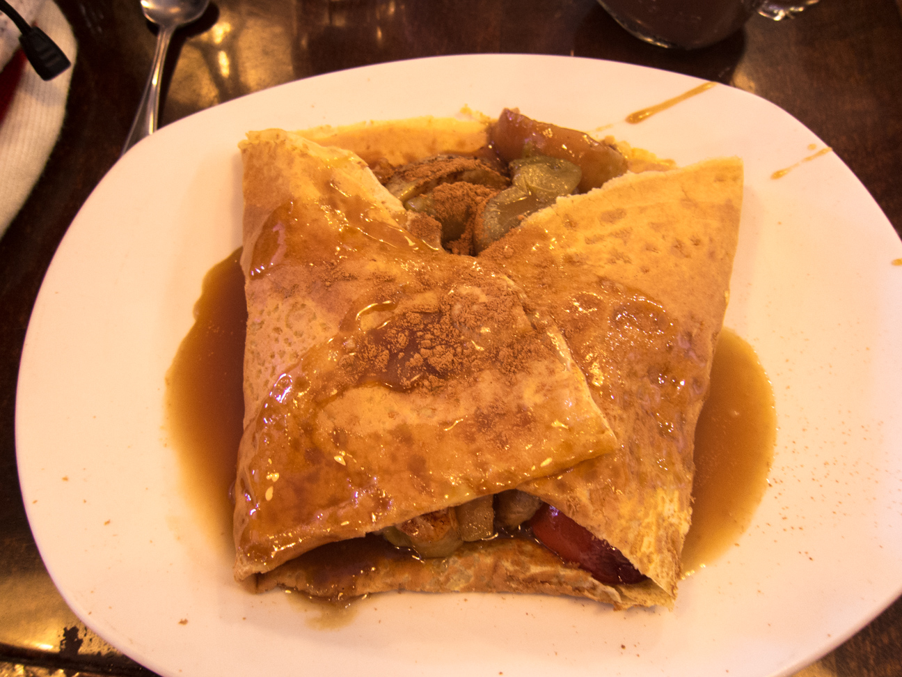 crepe filled with poached apples and cinnamon with maple cream