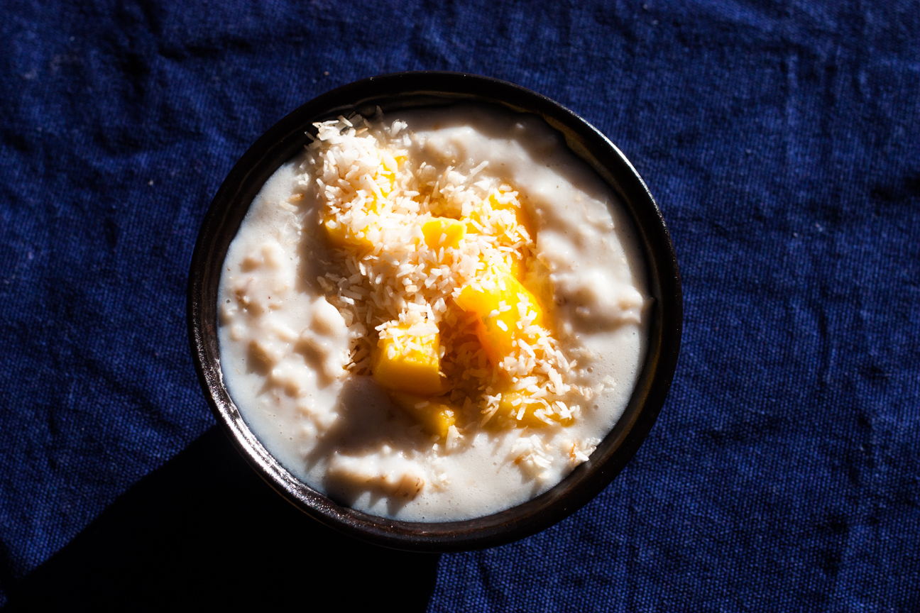 bowl of porridge with mango and coconut