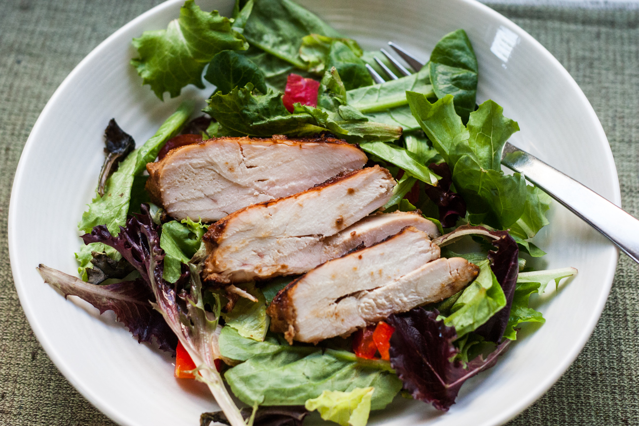 asian chicken on a bed of lettuce