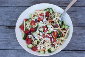 greek horiatiki pasta salad in a bowl