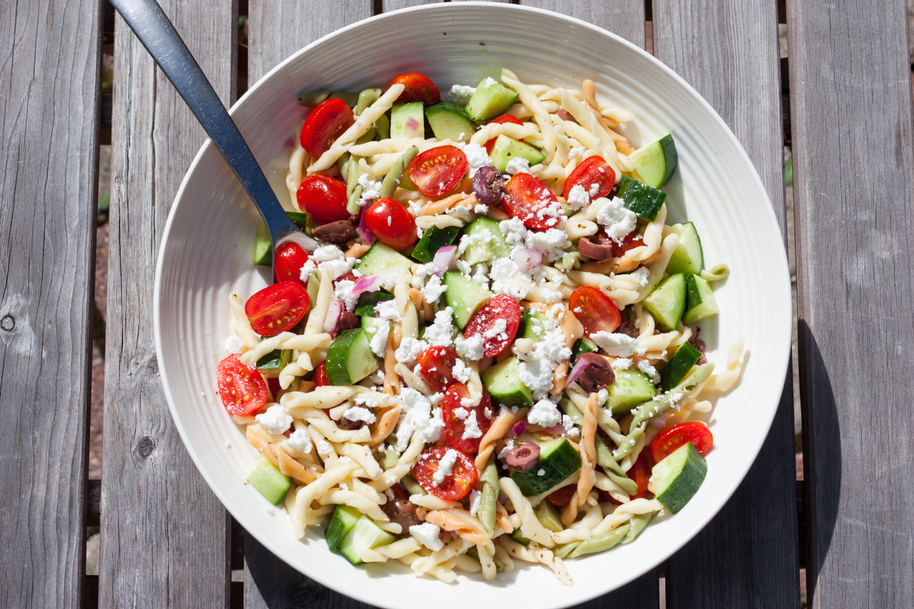 greek horiatiki pasta salad in a bowl