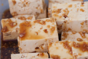 cubes of tofu marinating in orange soy honey tofu marinadecubes of tofu marinating in orange soy honey tofu marinade