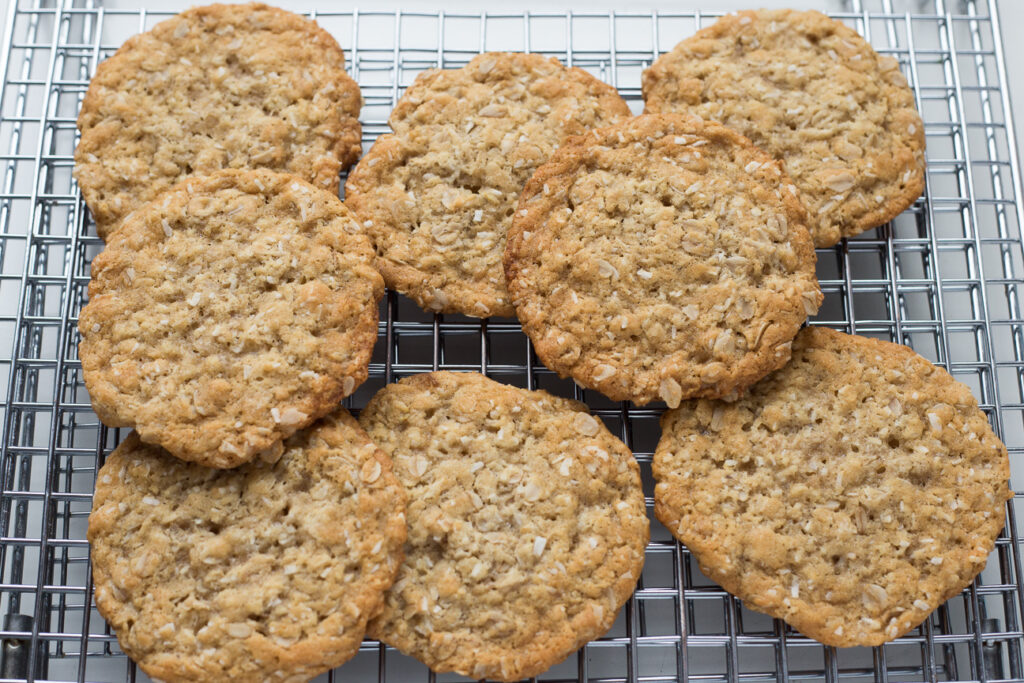 orange maple anzac cookies on cookie rack