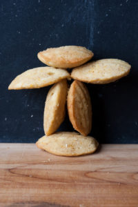 brown butter orange hazelnut madeleines in the shape of an inukshuk