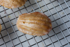 brown butter orange hazelnut madeleines with an orange glaze