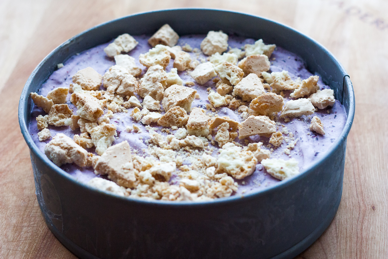 blueberry mango ice cream cake with amaretti biscuits on top