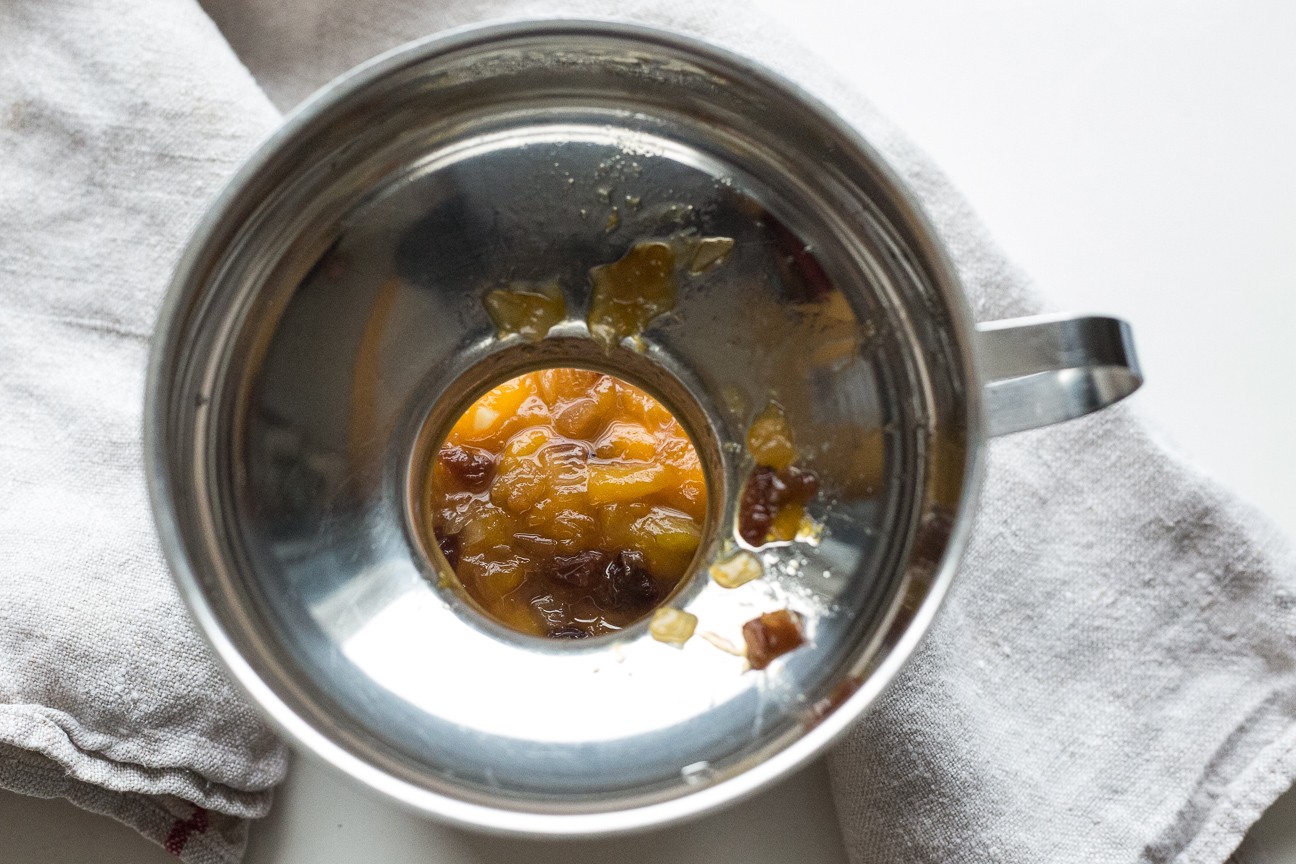 mango chutney ingredients with a funnel