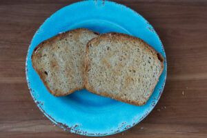toasted Honey Butter Whole Wheat Bread on blue plate