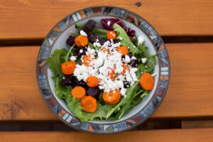 beet, carrot and feta salad in a bowl