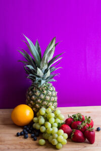fresh fruit arranged on a cutting board