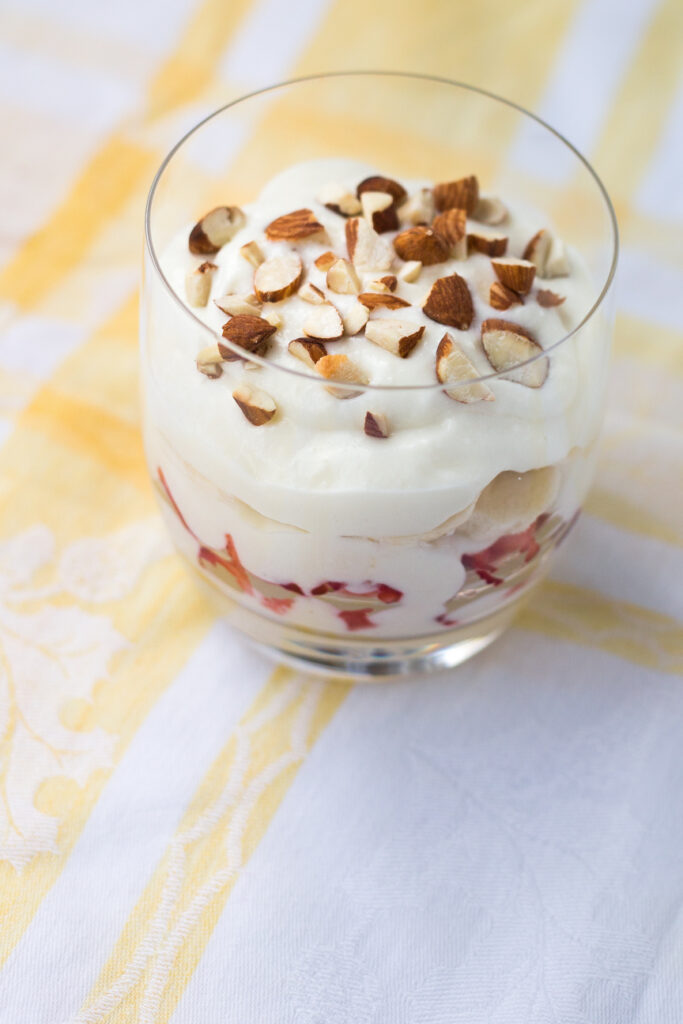 ashta and fruit and nuts in a parfait glass