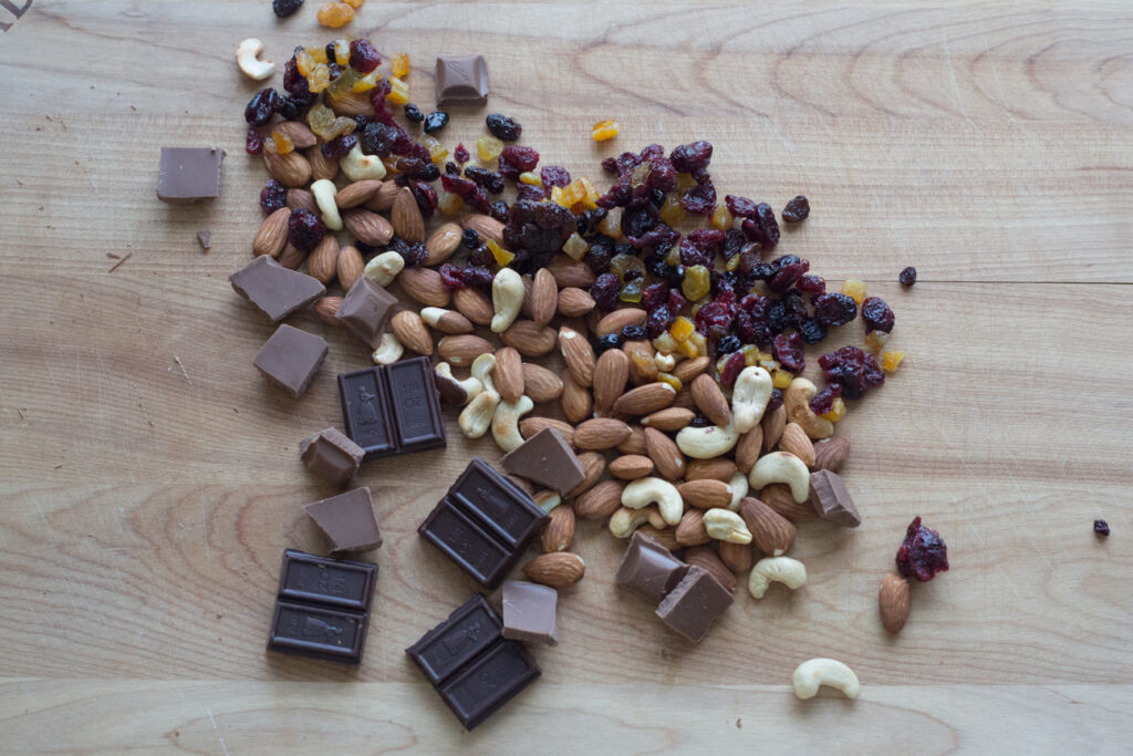 dried fruit and nuts on a cutting board