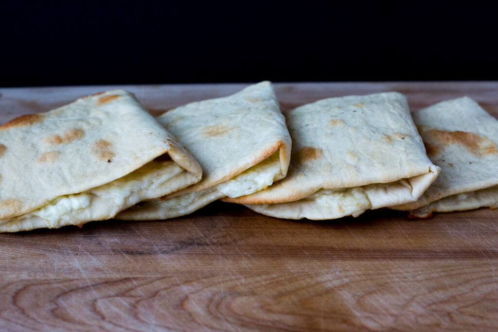 cheese pies on a cutting board