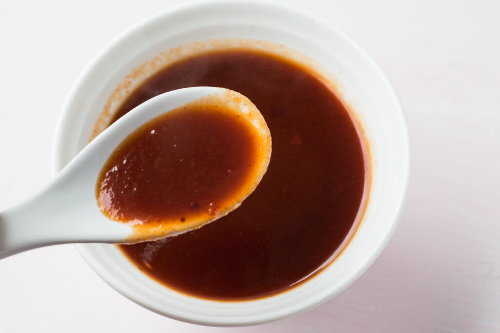 mumbo sauce on a spoon